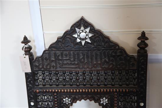 A late 19th century moorish open armchair and a similar armchair